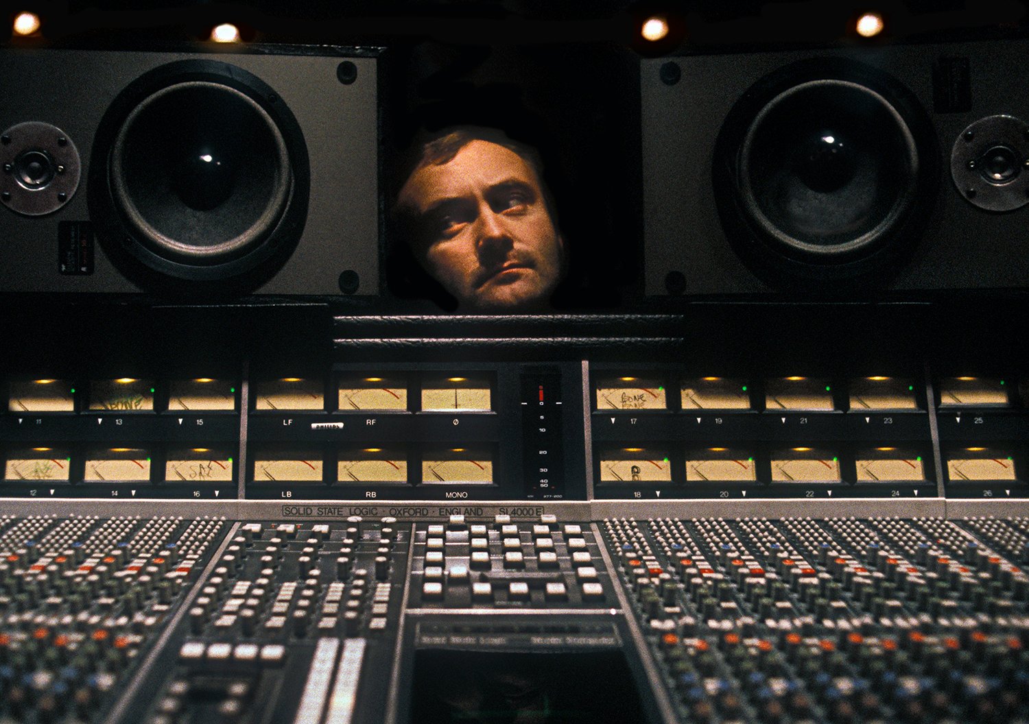 Photo of Phil Collins in his recording studio in Surrey UK 1984